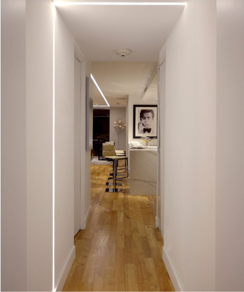 Application of the 12100-20-R-CW ceiling-to-wall linear recessed light in a hallway