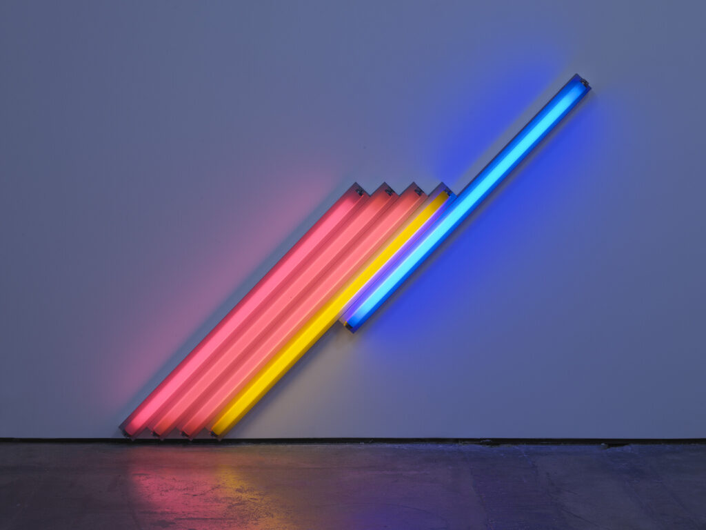 An untitled work for Frederika and Ian by Dan Flavin that uses pin, blue and yellow fluorescent lights set on a diagonal 