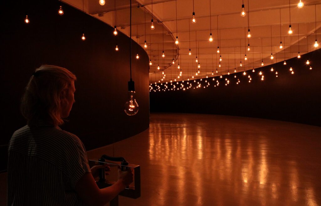 Rafael Lozano=Hemmer created Pulse Room to sync with a viewer's heartbeat so that the lights hung throughout the space pulse in time with the viewer.