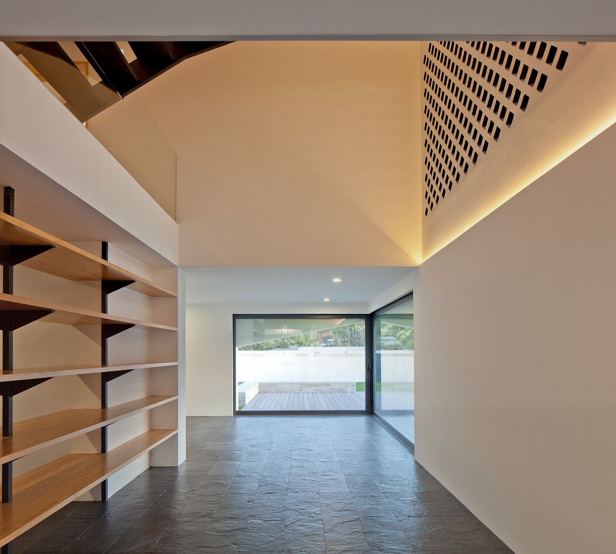 Cove lighting used in a yoga and meditation studio to highlight an architectural design element on the wall