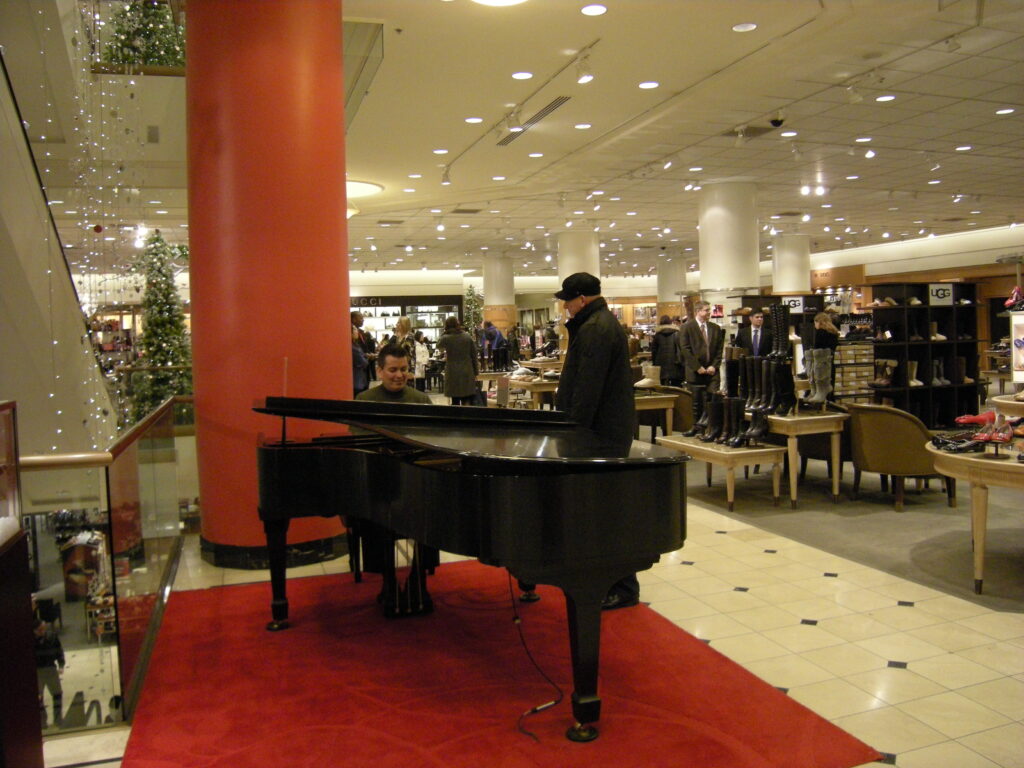 Live music performances like Joseph Rojo playing piano are one way stores like Nordstrom draw in customers