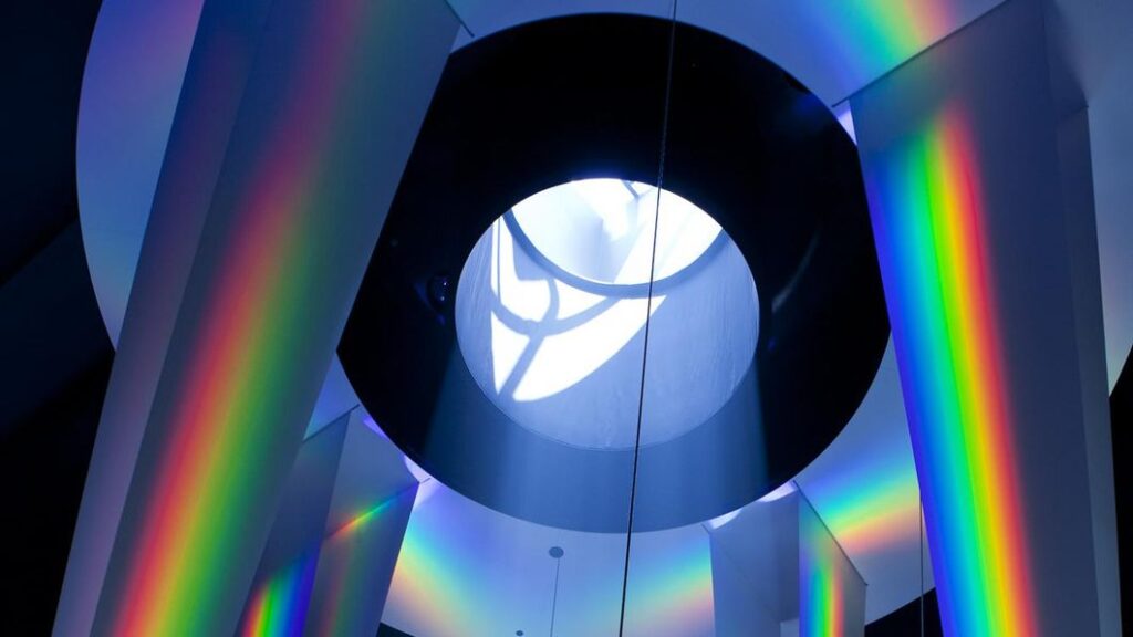 A large-scale recreation of Newton's prism on exhibit at the Chicago Museum of Science+Industry