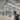 A closed medical lab, lit by linear pendants, also features clear emergency lighting in case of outages.