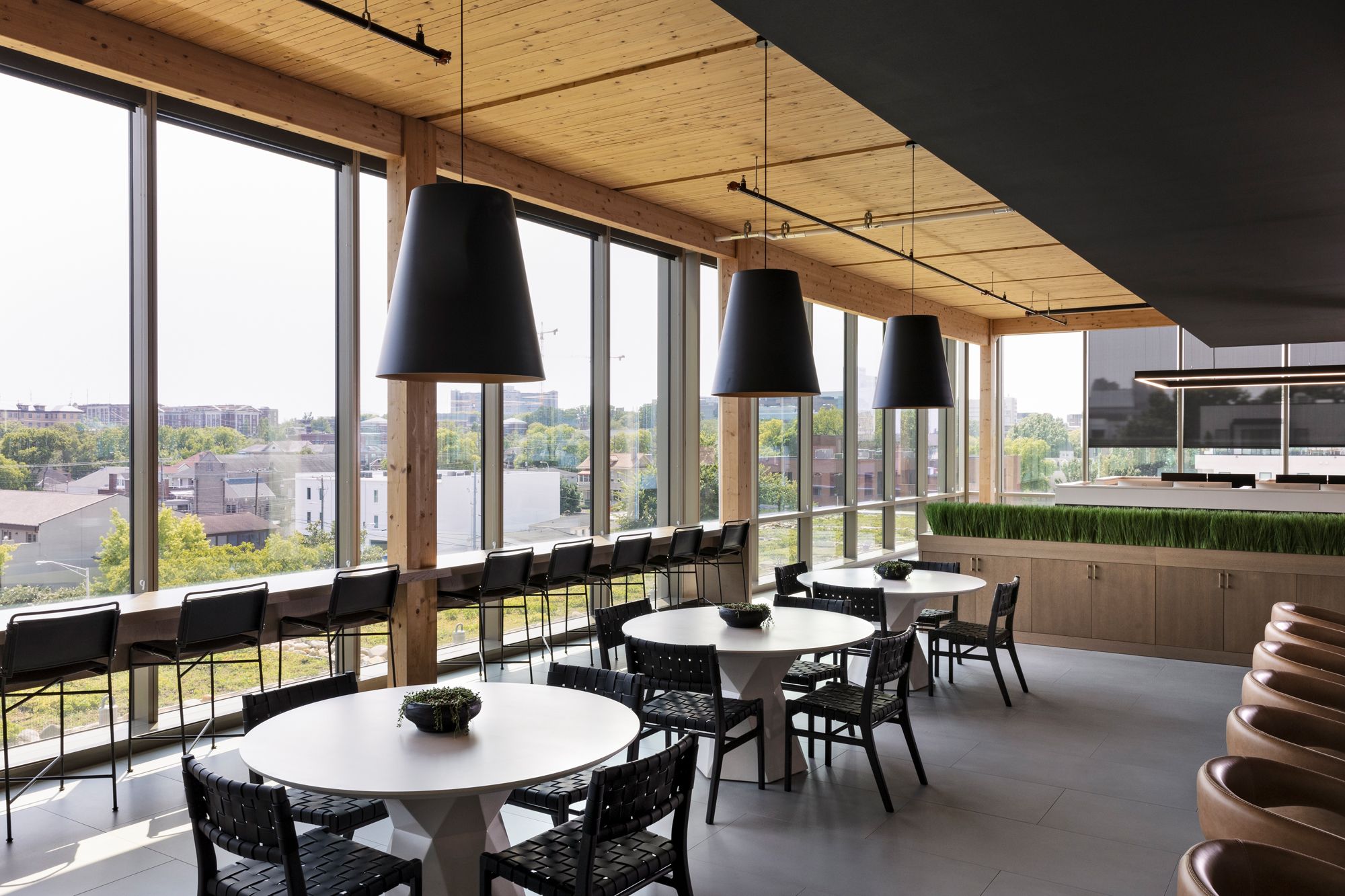 Tables look out over parks and suburban Nashville outside Elmington's office.