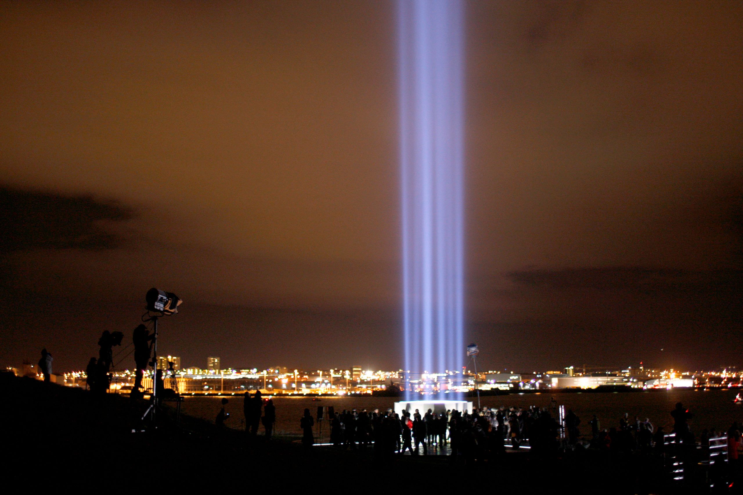 The Imagine Peace Tower projects 15 beams of light vertically over a wishing pool off the coast of Reykjavik, Iceland.