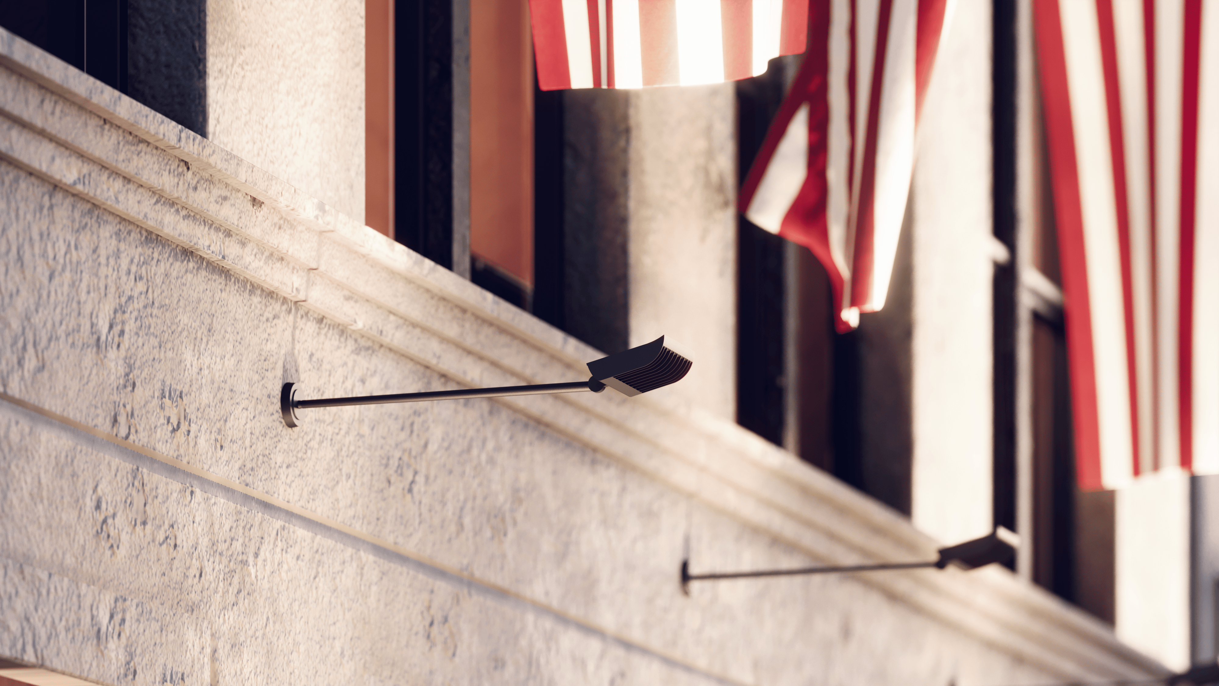 Alcon 31033 LED flag sign light mounted on building façade illuminating a vertically displayed American flag.