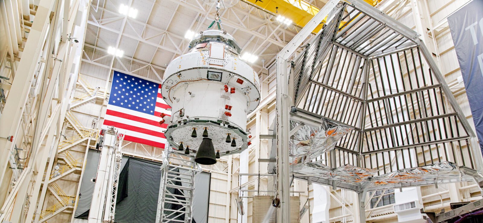 Engineers prepare the Artemis space capsule for thermal testing at NASA's Plum Brook Station