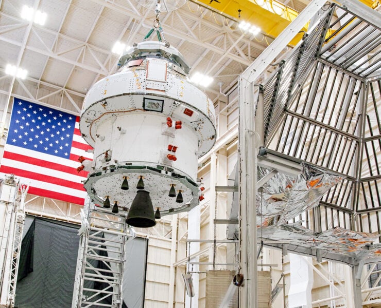 Engineers prepare the Artemis space capsule for thermal testing at NASA's Plum Brook Station