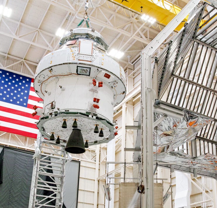 Engineers prepare the Artemis space capsule for thermal testing at NASA's Plum Brook Station