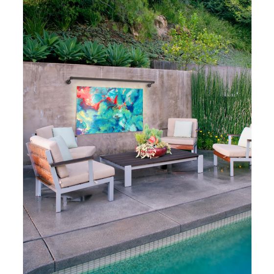 The 11704 outdoor sign and art light by Alcon Lighting shown with a black matte finish lighting backyard wall art in a luxury home patio