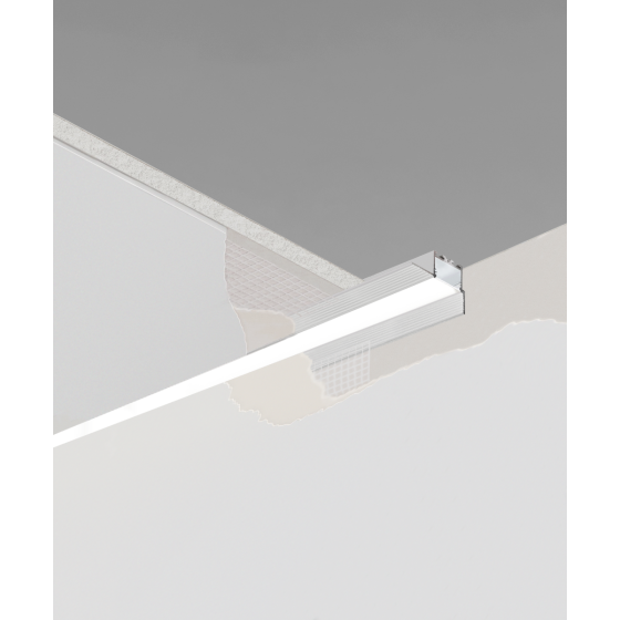 12100-10-R-PR recessed linear perimeter ceiling light by Alcon Lighting, shown with a silver finish and flush trimless lens.