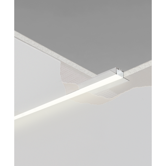 Alcon 12100-10-R, recessed linear ceiling to wall light shown in silver finish and with a flush trim-less lens.