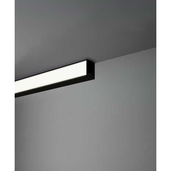 Alcon 12100-13-S, surface linear ceiling light shown in black finish and with a flush trim-less lens.