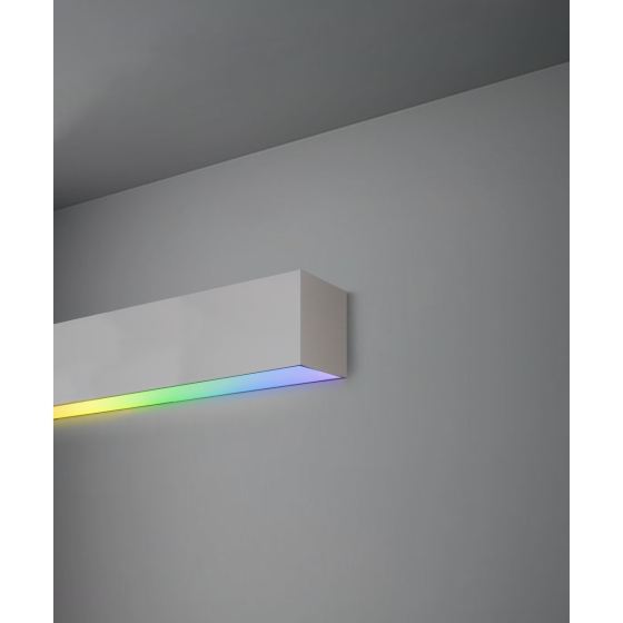 Alcon 12100-20-W-RGBW, surface mount linear wall light shown in silver finish and with a flush trim-less bottom color changing lens.