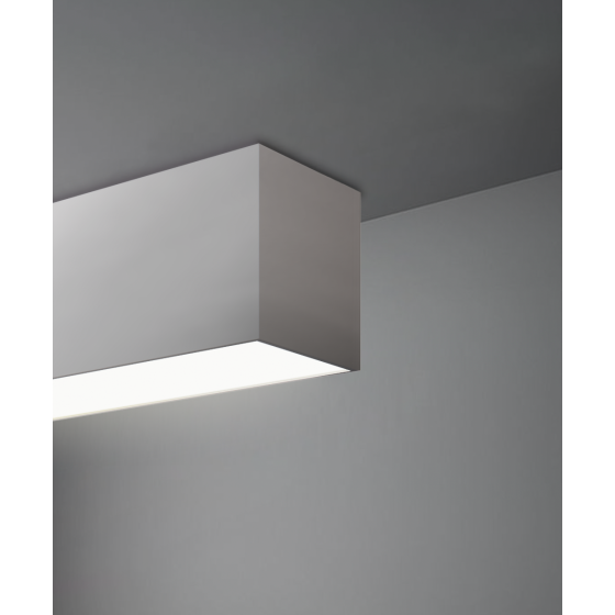 Alcon 12100-33-S, surface linear ceiling light shown in silver finish and with a flush trim-less lens.