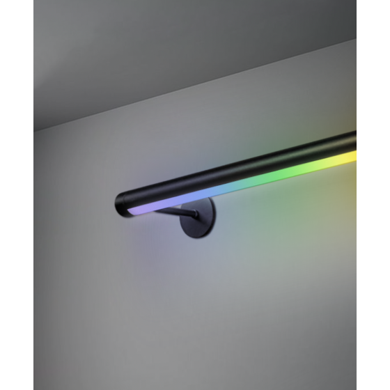 Alcon 12100-R2-W-RGBW, surface mount linear wall light shown in black finish and with a flush trim-less curved color changing lens.