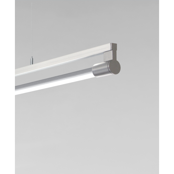 Alcon 12160-P, suspended linear pendant light shown in silver finish and with a rotating cylindrical half-lite lens.