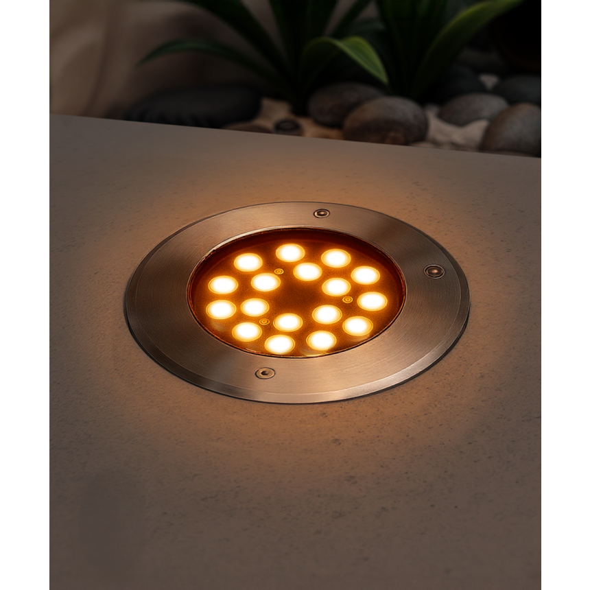 The 14127-8 in-ground well light by Alcon Lighting with a clear, 8-inch shatterproof lens shown with a stainless steel finish
