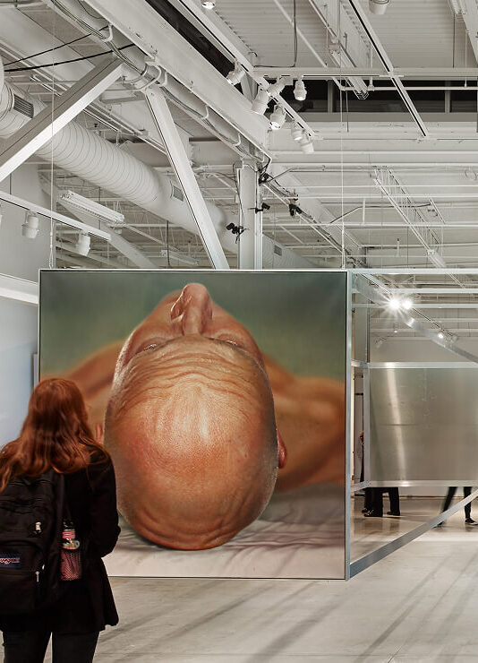 Adjustable cylinder head track lights provide a mix of accent downlighting and directed lighting for artwork at the Pearlstein Gallery.