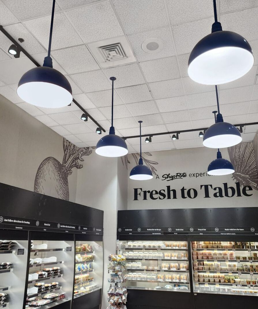 15201 RLM low bay with a blue exterior and white interior finish on a drop tile grid ceiling of a grocery store