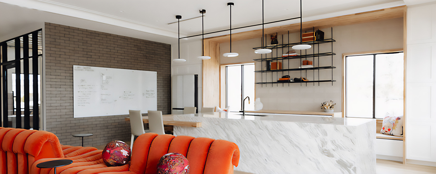 Office break room lighting at HBHQ used Alcon Lighting's recessed light for general lighting with pendant task lighting over the kitchen island