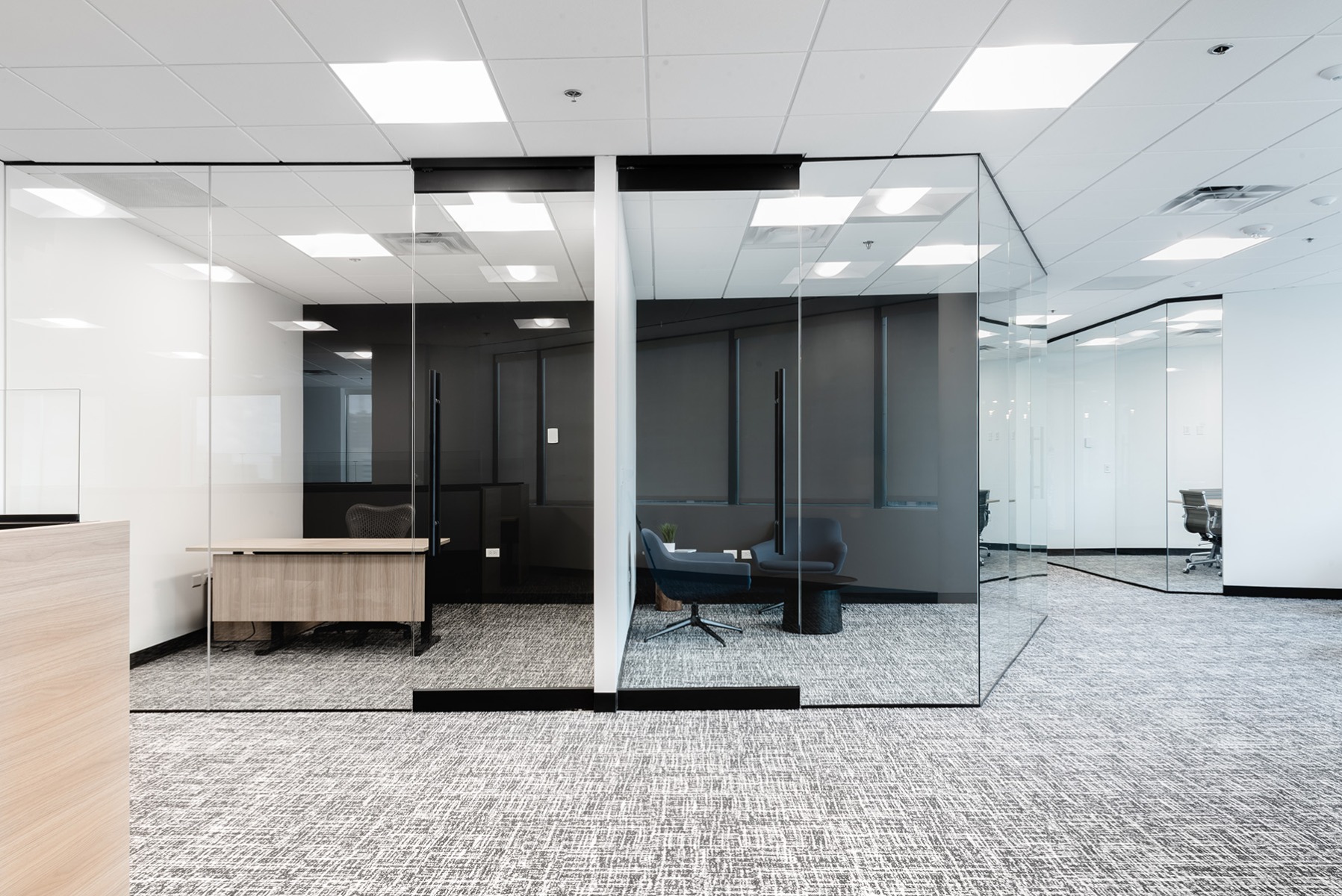 Panel lighting in the grid ceiling of the private offices at Tabor Center provide cool white light that’s beneficial for task focus while working.