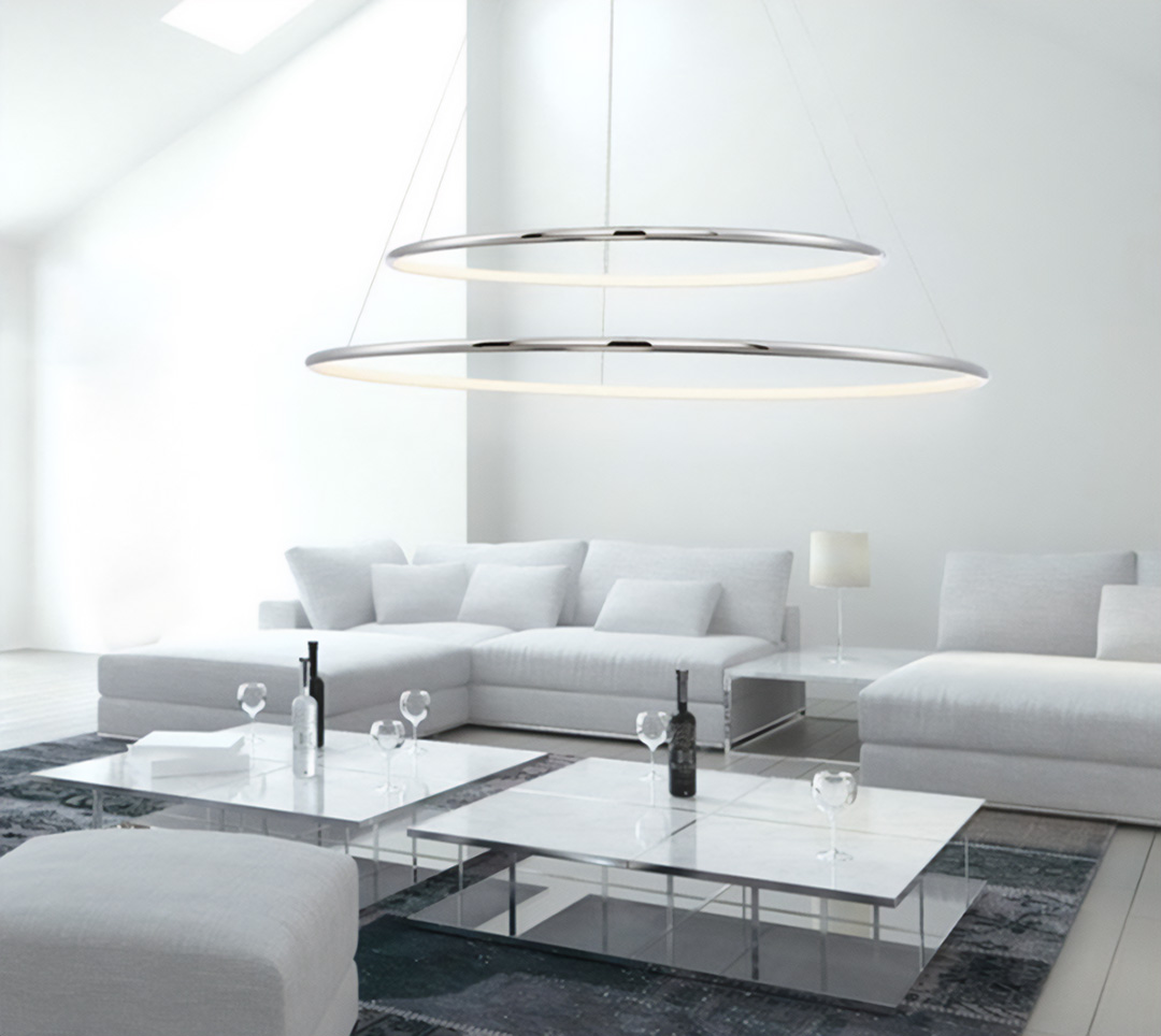 A 2-tier ring chandelier pendant light hangs over a clean, modern living room