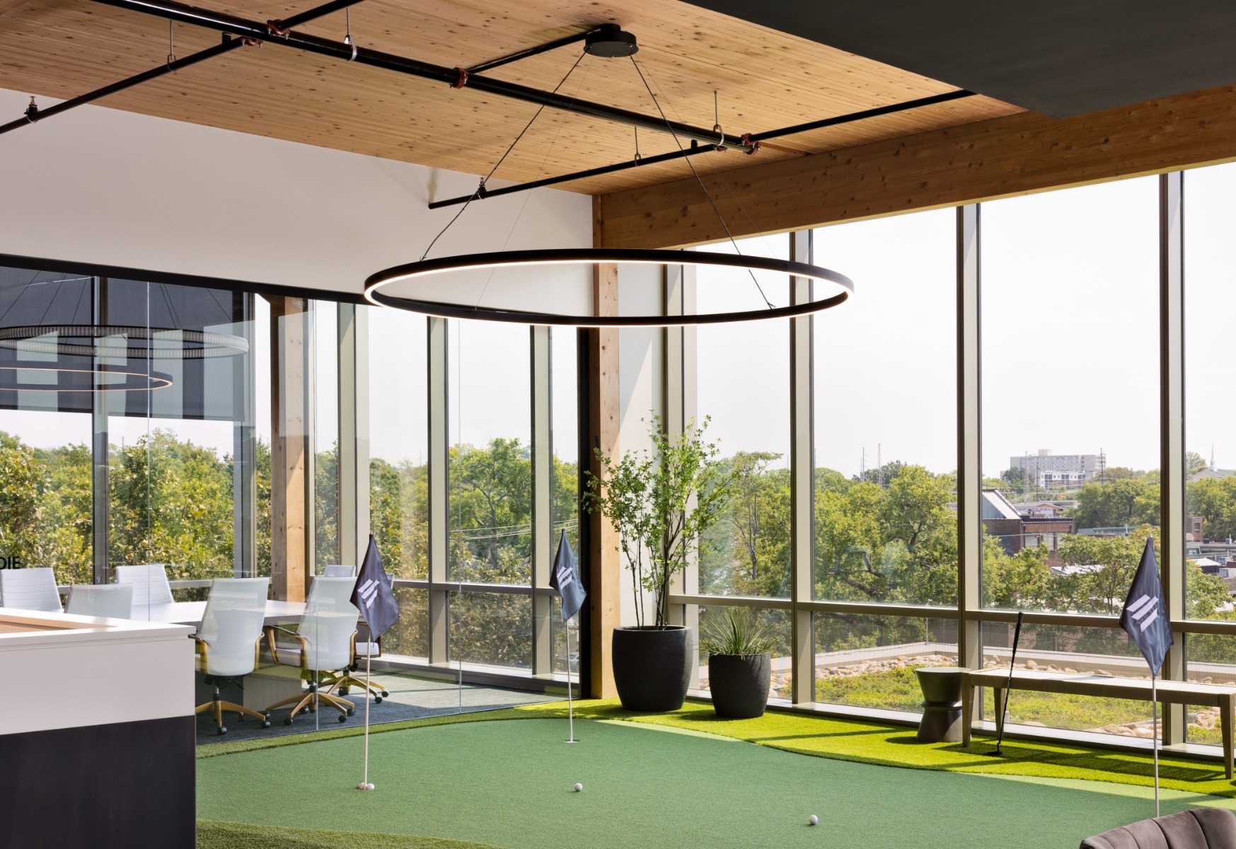 Application of 12253 Slim Linear Ring Pendant over a putting green in an office.