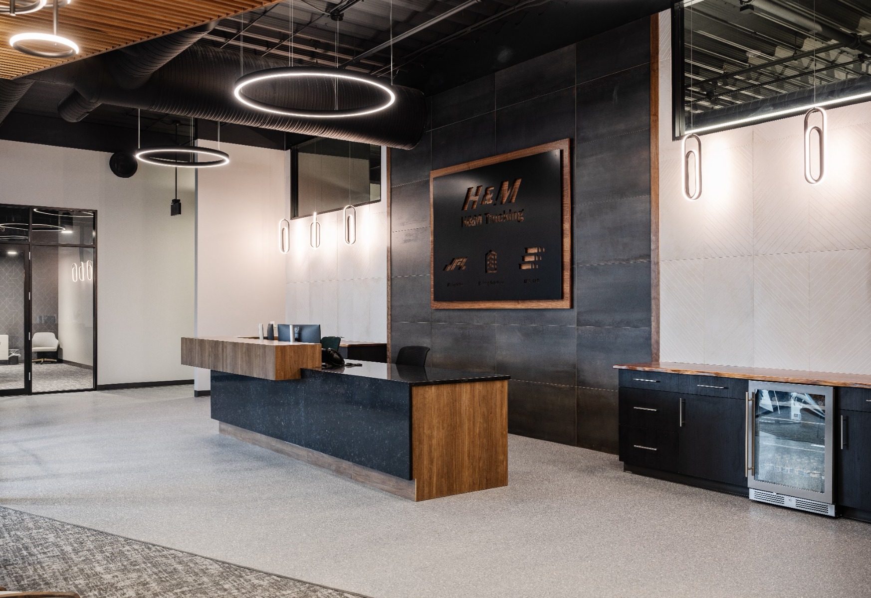 Modern linear LED suspension lights provide high-CRI lighting at The Commune creative coworking space in Austin, Texas