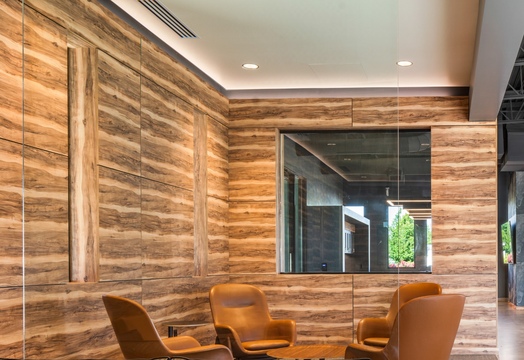 Linear light fixtures help hightlight both the original bones and new construction of a renovated textile mill turned creative coworking space.