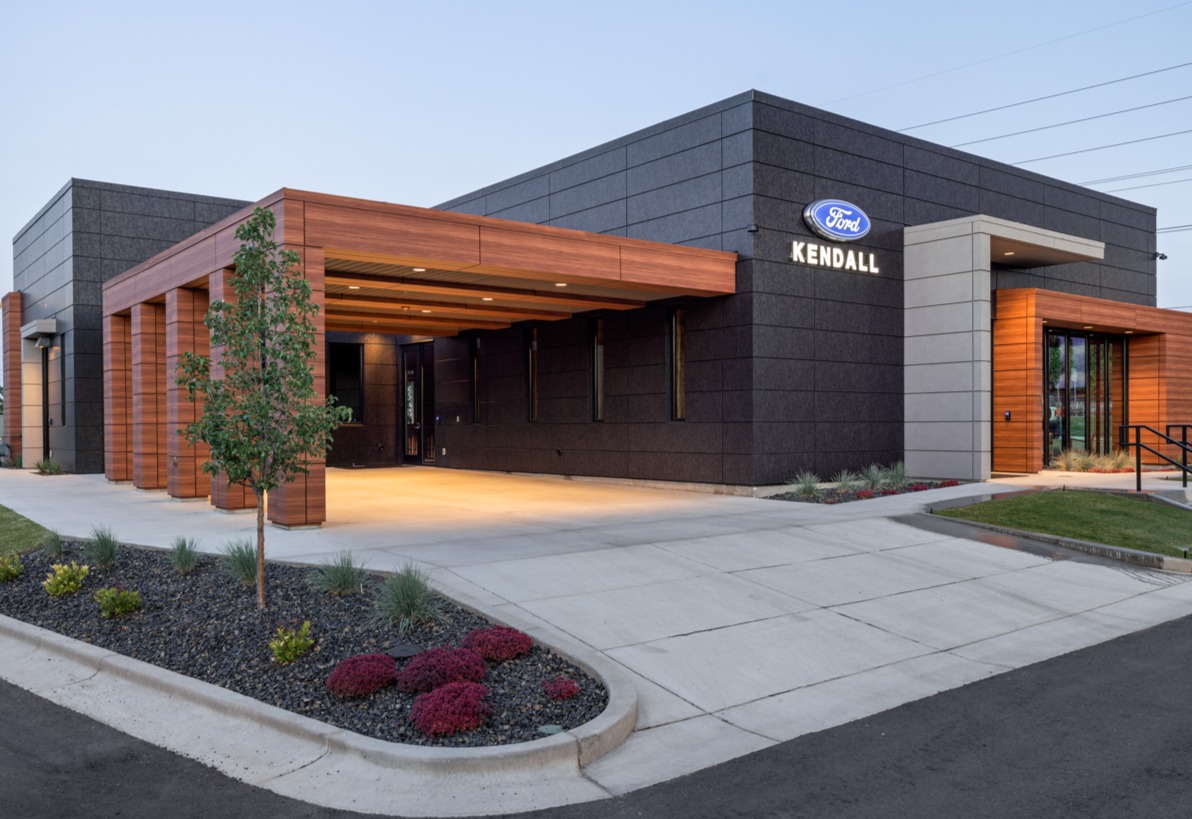 Round recessed LED can lights illuminate the entrances of the Kendall Ford Bronco car dealership.