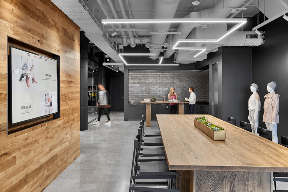 Linear suspension lighting shown with 90-degree angle connectors can make original geometric designs as shown in this retail space