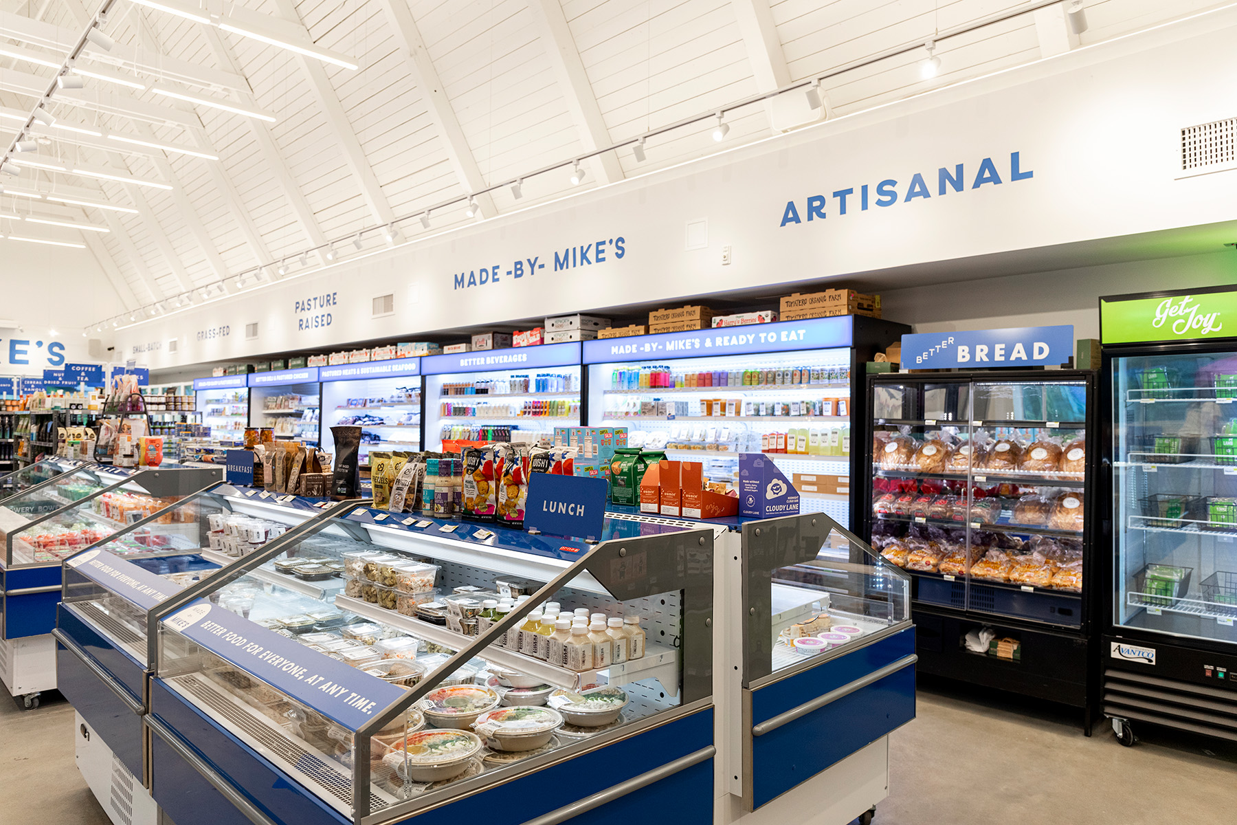  Openshop used Alcon Lighting LED Track Lights to highlight signage and products in the store, which can also be adjusted to light in-store events