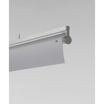 Alcon 12160-P-WW, suspended linear pendant light shown in silver finish, with a rotating cylindrical half-lite lens, and a curved silver wall washing lens cap.